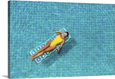 Woman In A Yellow Bikini, Swims In The Pool Of A Luxury Hotel, Summer Vacation