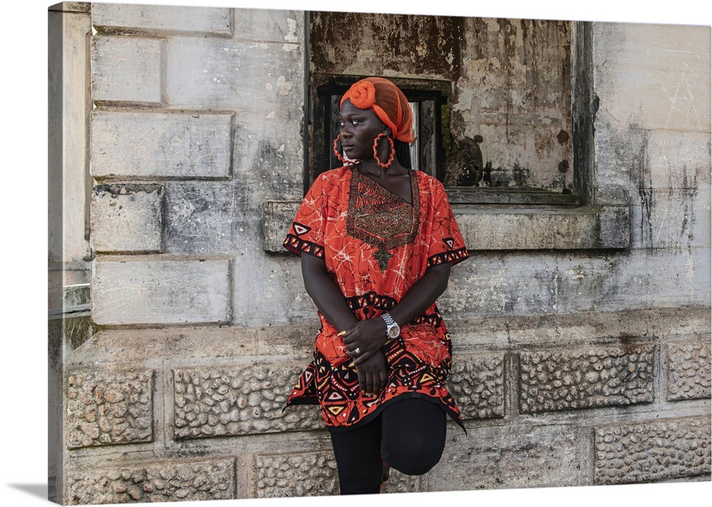 Woman Stands By Old Building With Traditional Orange African Dress, Takoradi, Ghana