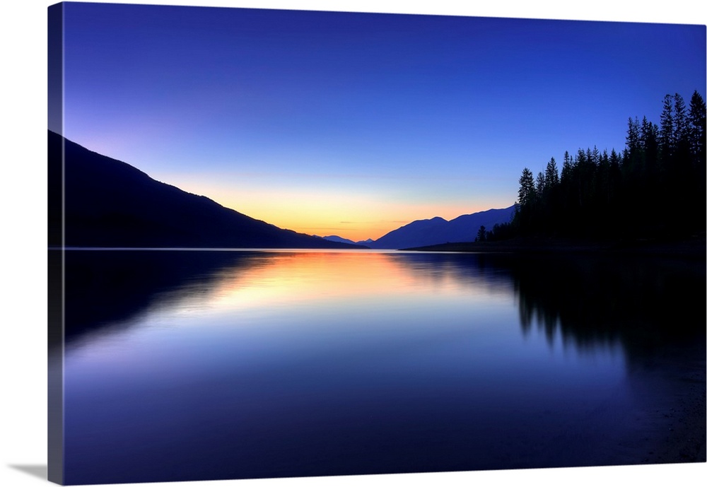 A beautiful blue and orange sunset on a mountain lake in British Columbia, Canada.