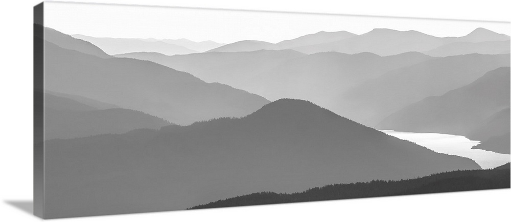 Black and white image of many layers of mountain range in the Monashee Mountains, Canada.