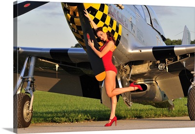 1940's style pin-up girl posing with a P-51 Mustang