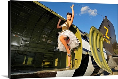 1940's style pin-up girl standing inside of a C-47 Skytrain aircraft
