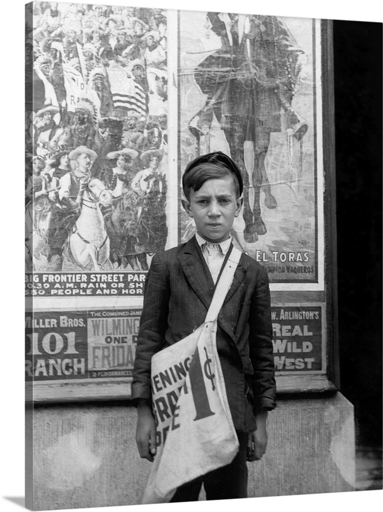 A 12 year old newspaper boy selling newspapers in Wilmington, Delaware.