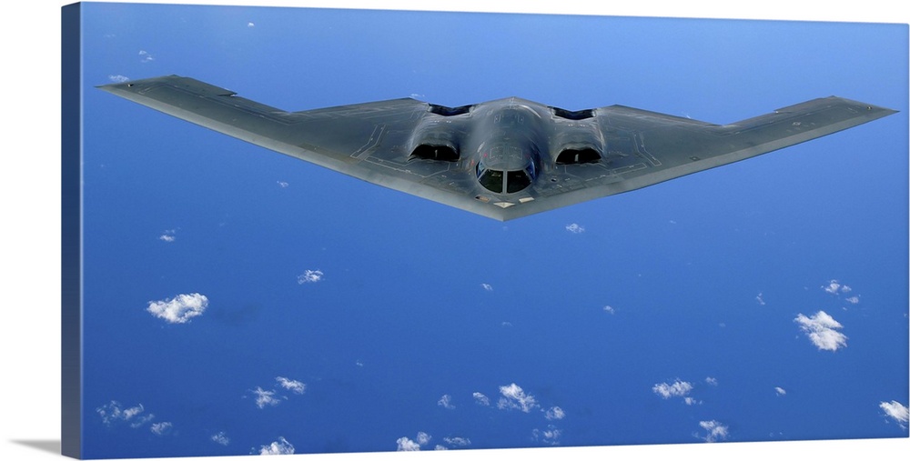 A B-2 Spirit soars through the sky after a refueling mission.