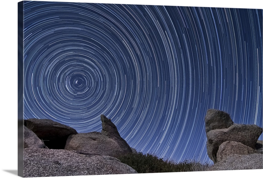 A boulder outcropping and star trails in the high desert of Anza Borrego Desert State Park, California.