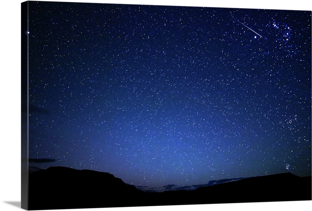 A bright sporadic meteor crossing Orion in the dark patagonic skies of Somuncura, Argentina.