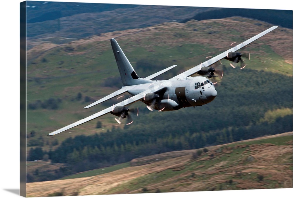A C-130 Hercules of the Royal Air Force flying over North Wales, United Kingdom.