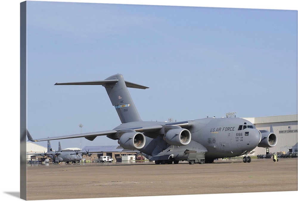 A C-17 Globemaster III parked on the ramp at an Air Force base.
