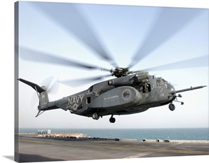 A CH-53 Sea Stallion helicopter leaves the flight deck of USS Kearsarge image thumbnail