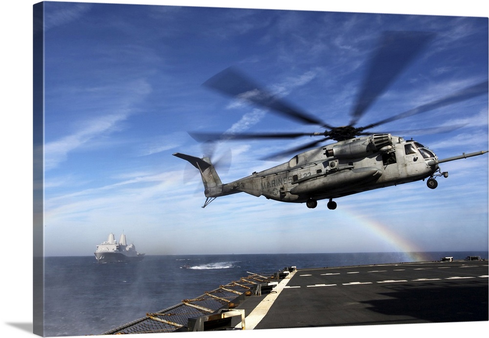December 7, 2011 - A CH-53E Super Stallion prepares to land on the USNS Arctic during a simulated Expanded, Visit, Board, ...