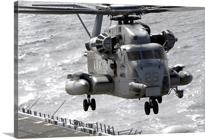 A CH53E Super Stallion helicopter takes off from USS Makin Island
