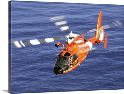 A Coast Guard HH 65A Dolphin rescue helicopter in flight