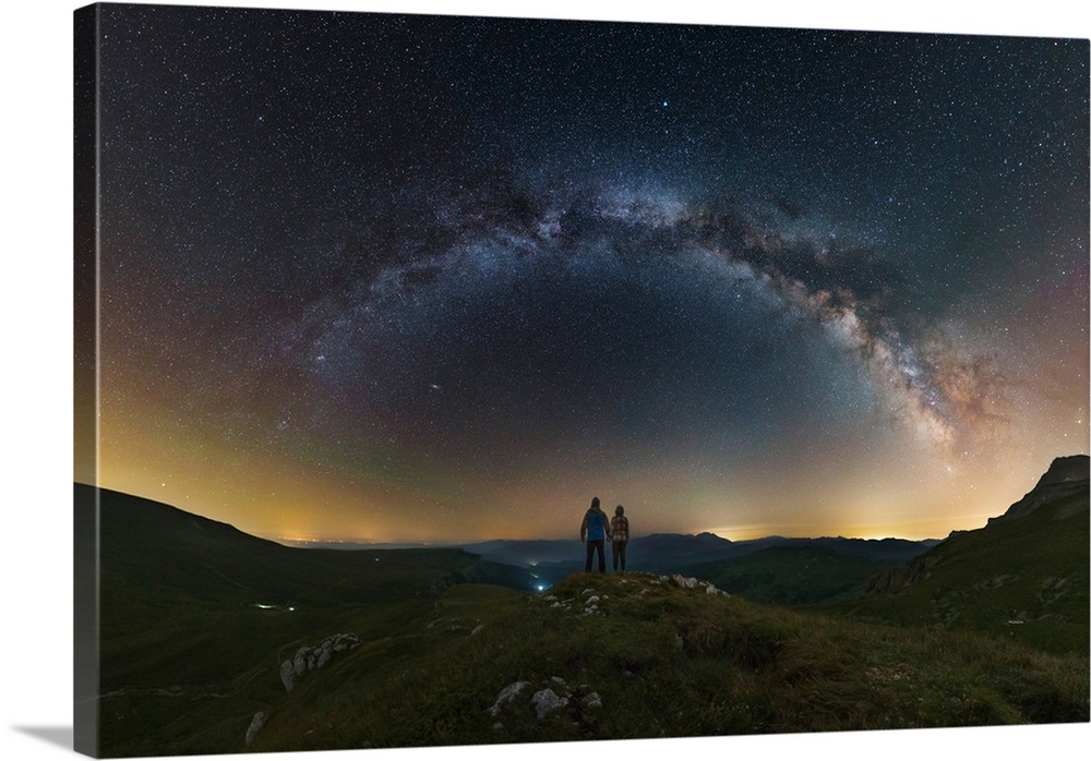 A couple gazing at the Milky Way from atop the Lago-Naki plateau overlooking Russia.