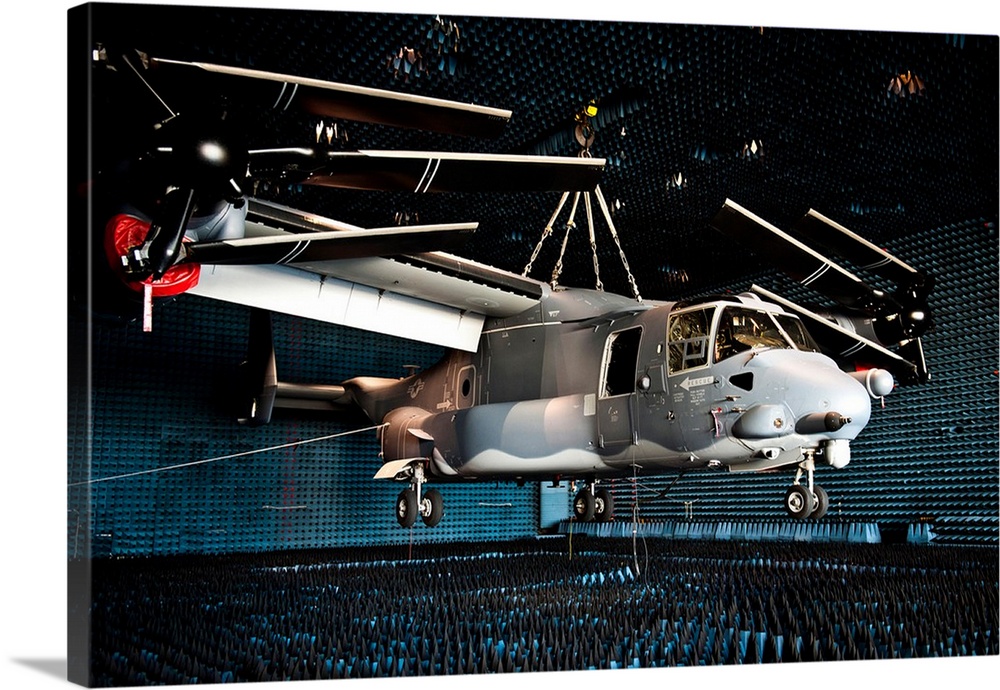 A CV-22 Osprey hangs in a anechoic chamber.