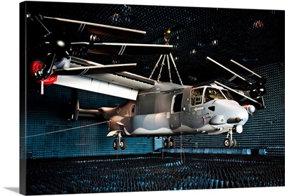 A CV-22 Osprey hangs in a anechoic chamber