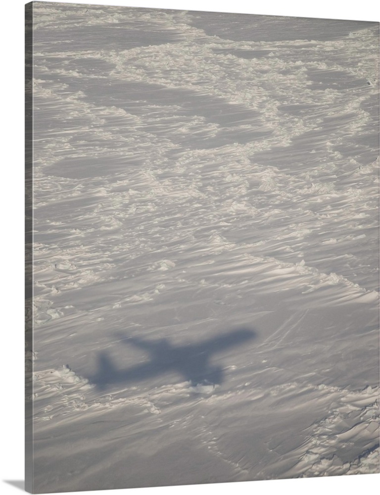 A DC-8 aircraft casts its shadow over the Bering Sea.