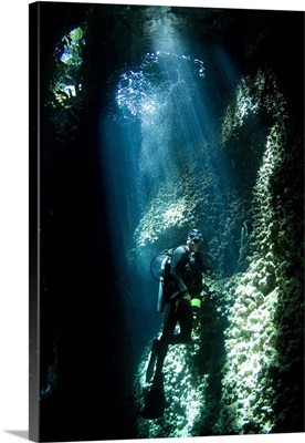 A diver explores the Lerus Cut underwater cavern, Solomons