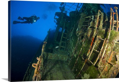 A diver explores the wreck of the Soltai 61, Solomon Islands