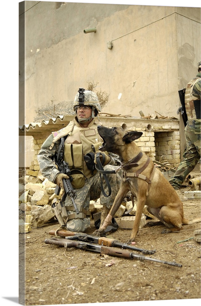 A dog handler and his military working dog take a short break.