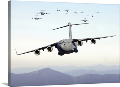 A formation of 17 C17 Globemaster IIIs fly over the Blue Ridge Mountains