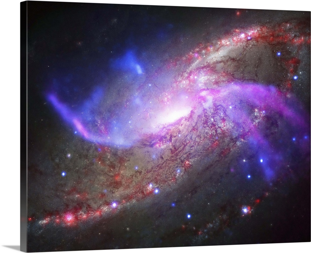 A galactic light show in spiral galaxy NGC 4258, also known as M106, about 23 million light years away. This galaxy is fam...