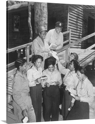 A group of nurses receiving their first batch of mail from home in Australia