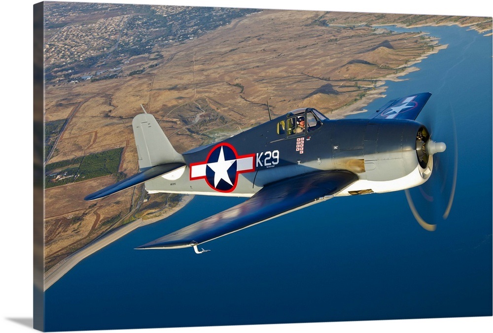 A Grumman F6F Hellcat fighter plane in flight Wall Art, Canvas Prints ...