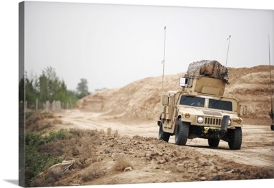 A Humvee conducts security during a patrol in the Iraqi village of Bakr