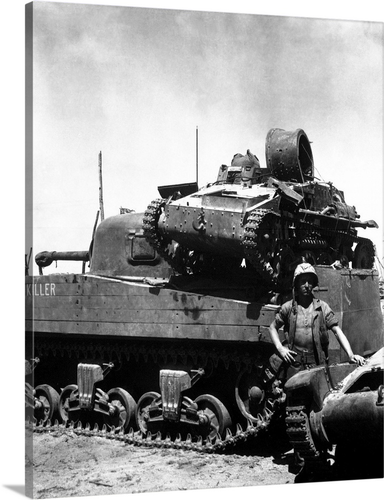 A Japanese light tank sits atop the medium tank Killer, 1944.