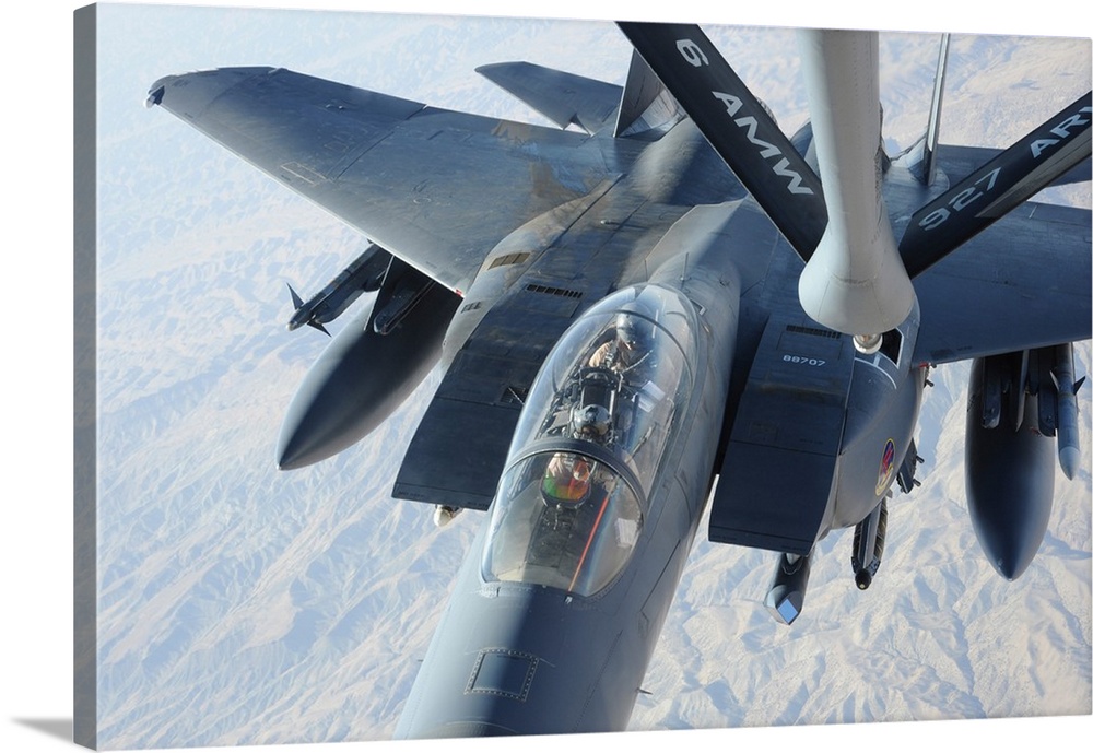 A KC-135 Stratotanker refuels an F-15E Strike Eagle.