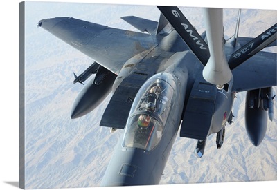 A KC-135 Stratotanker refuels an F-15E Strike Eagle