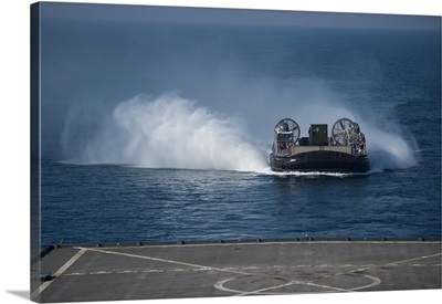 A Landing Craft Air Cushion Makes Its Approach To The Well Deck Of USS Comstock