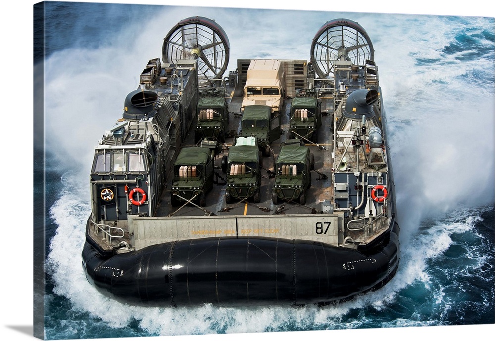 Atlantic Ocean, April 10, 2012 - A landing craft air cushion (LCAC) approaches the well deck of the multi-purpose amphibio...