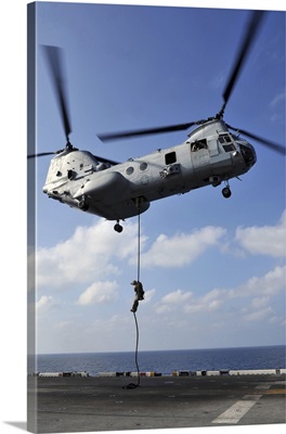 A Marine Fast Ropes From A CH-46E Sea Knight Helicopter
