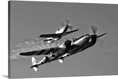 A P 38 Lightning and P 51D Mustang in flight