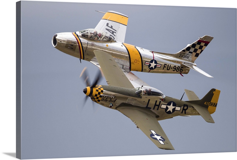 A P-51 Mustang and F-86 Sabre of the Warbird Heritage Foundation carry out a heritage pass at Waukegan, Illinois.