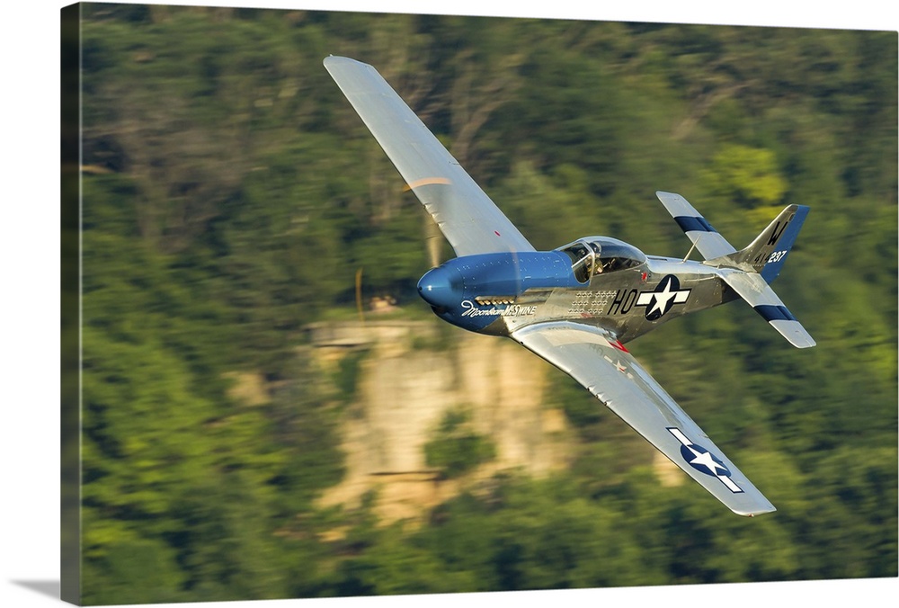A P-51 Mustang flies along the Mississippi at Dubuque, Iowa.