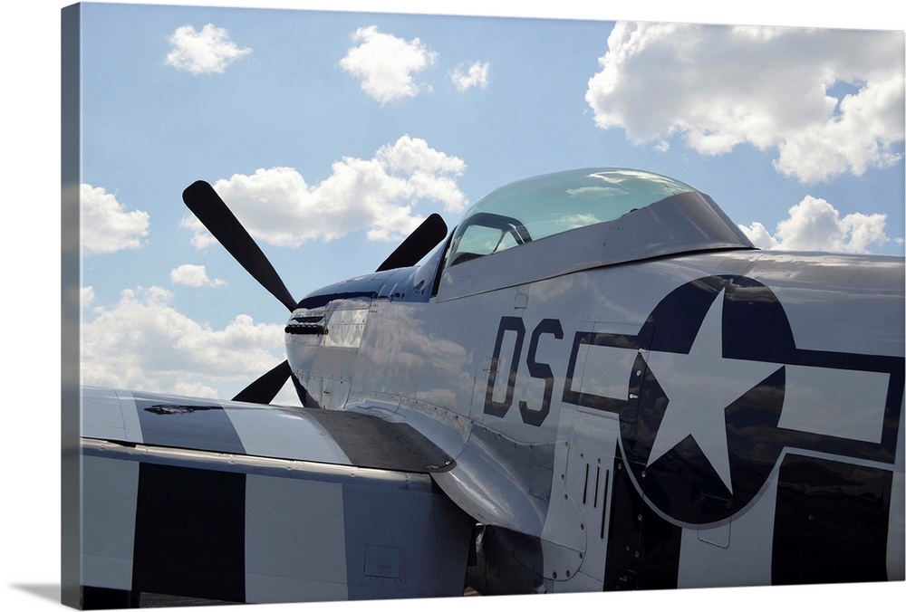 A P-51D Mustang parked on the flight line.