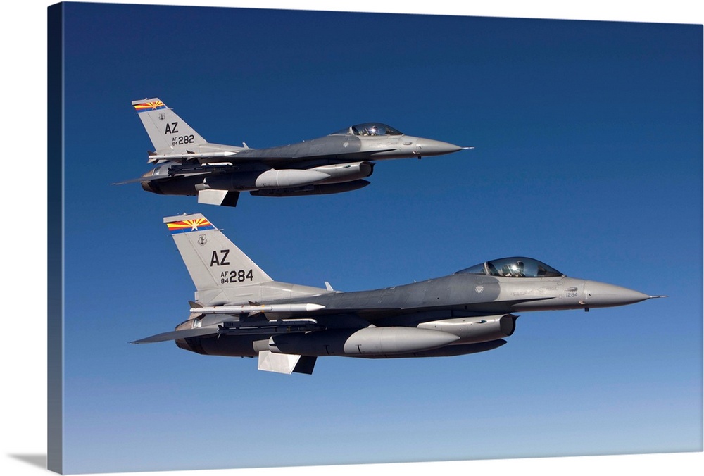 A pair of F-16's from the 162nd Fighter Wing fly in formation during a training mission out of Tucson, Arizona.