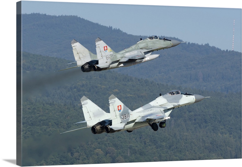 A pair of Slovak Air Force MiG-29AS scrambling for quick reaction alert mission.