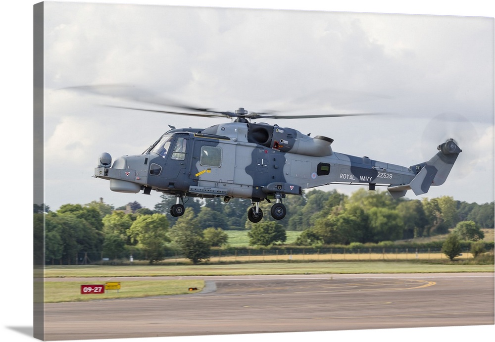A Royal Navy Wildcat helicopter landing at RAF Fairford in the United Kingdom.