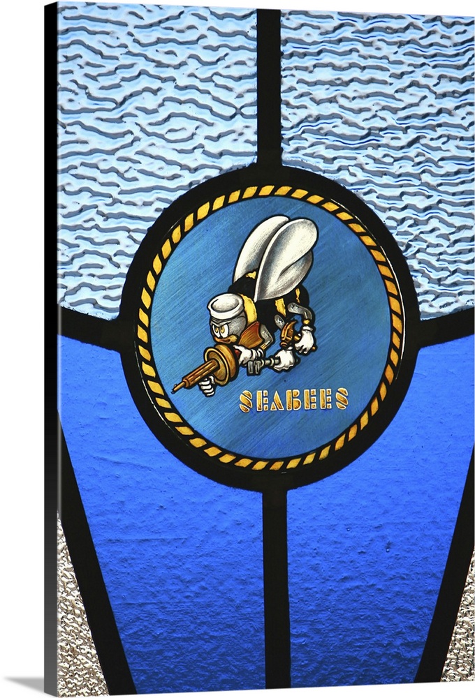 A single Seabee logo built into a stainedglass window