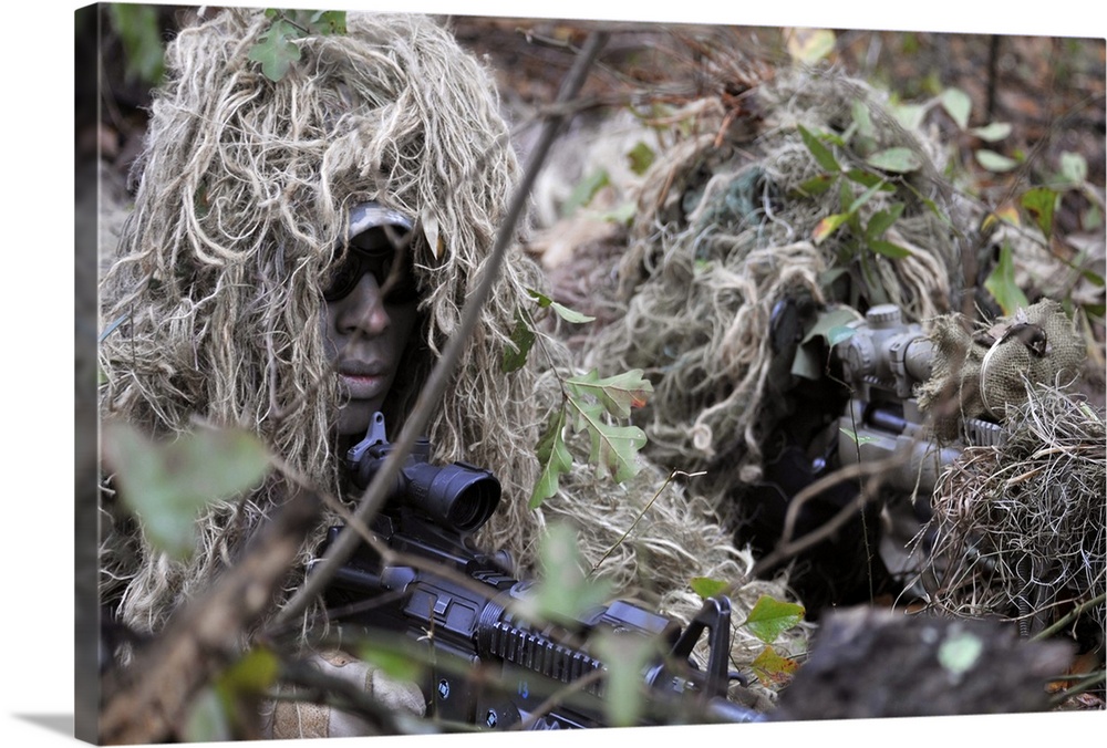 February 10, 2011 - A sniper team spotter and shooter prepare to provide cover fire during an urban operations training de...