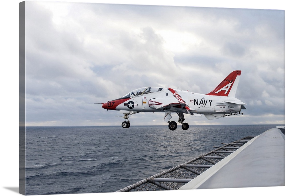 A T-45C Goshawk training aircraft launches from the flight deck of USS Harry S. Truman.