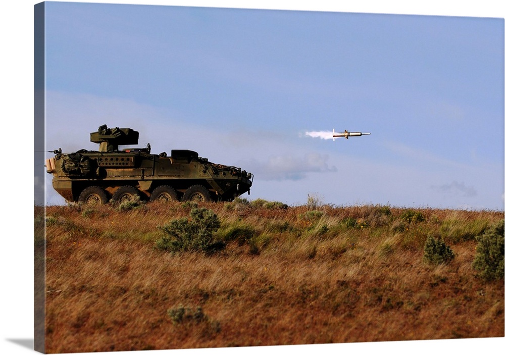 A TOW missile is launched from an armored vehicle.