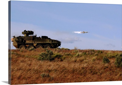 A TOW missile is launched from an armored vehicle