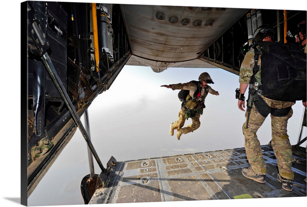 July 30, 2012 - A U.S. Air Force pararescueman jumps out of the back of an HC-130P Combat King aircraft over the Grand Bar...