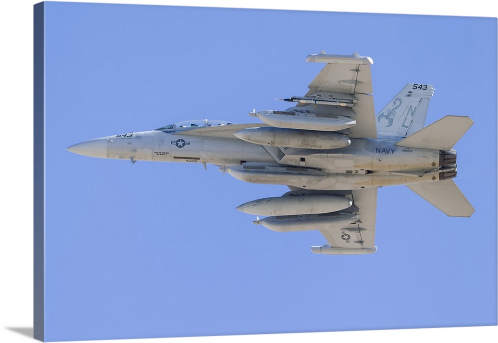 A U.S. Navy E/A-18G Growler climbs out of Nellis Air Force Base, Nevada, on a Red Flag mission.