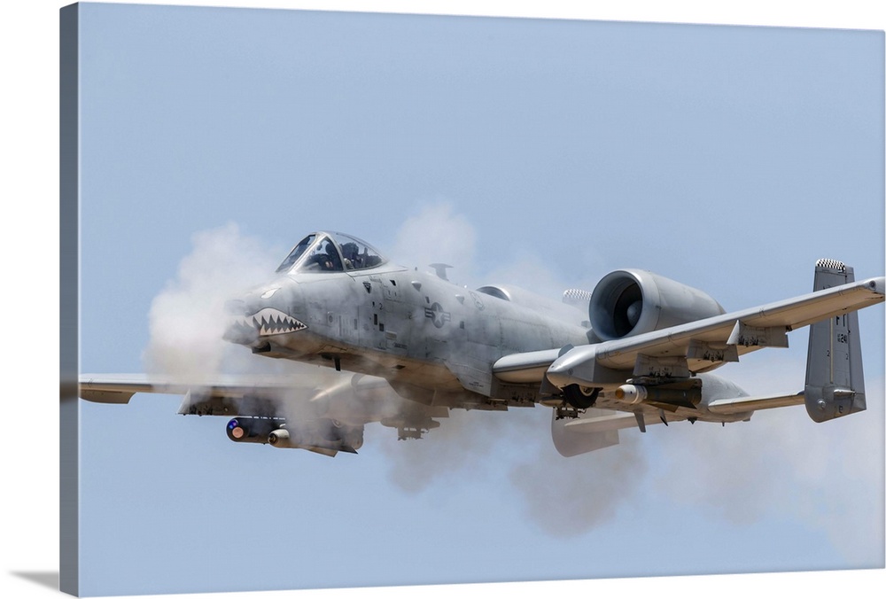 A U.S. Air Force A-10 Thunderbolt II fires its 30mm gun at a strafe target.