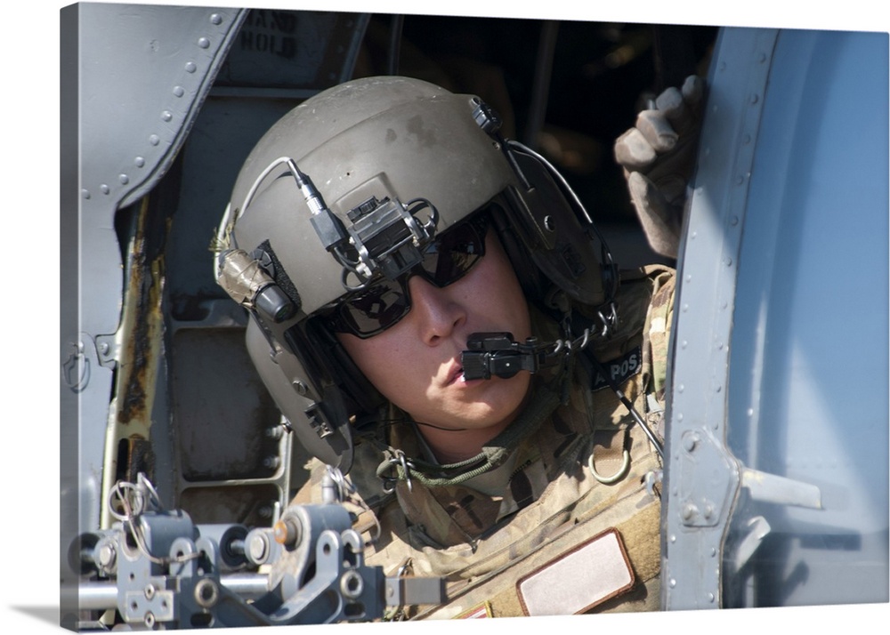 San Diego, November 7, 2012 - A U.S. Air Force Airman peers out the side of a HH-60 Pave Hawk helicopter during a simulate...